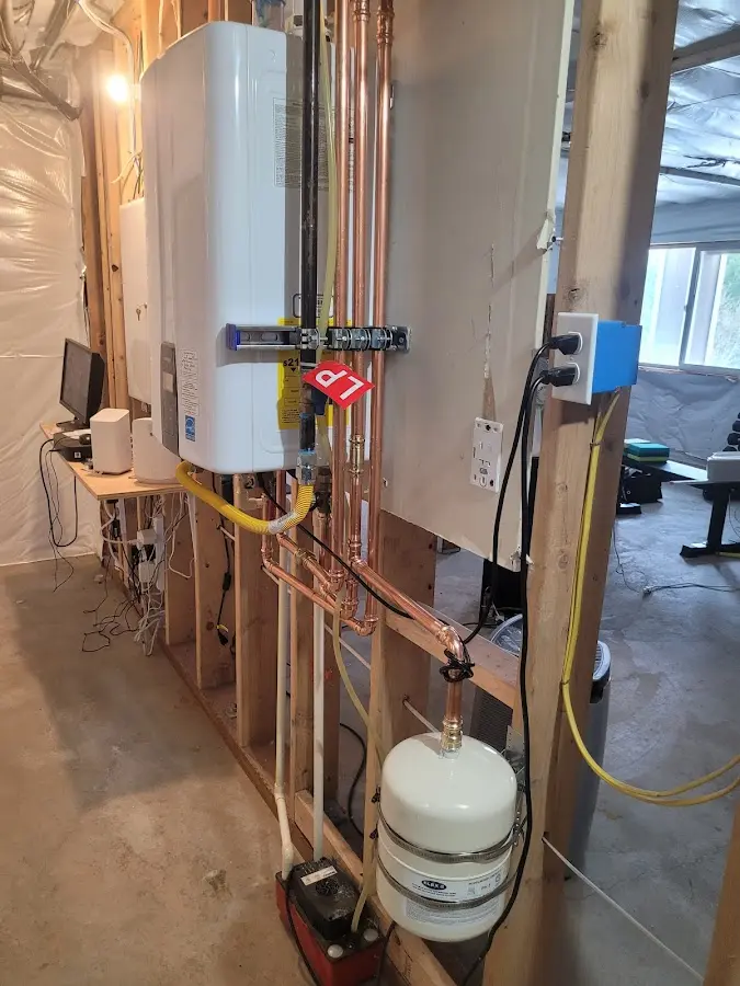 Licensed plumber repairing a kitchen sink in Hempstead